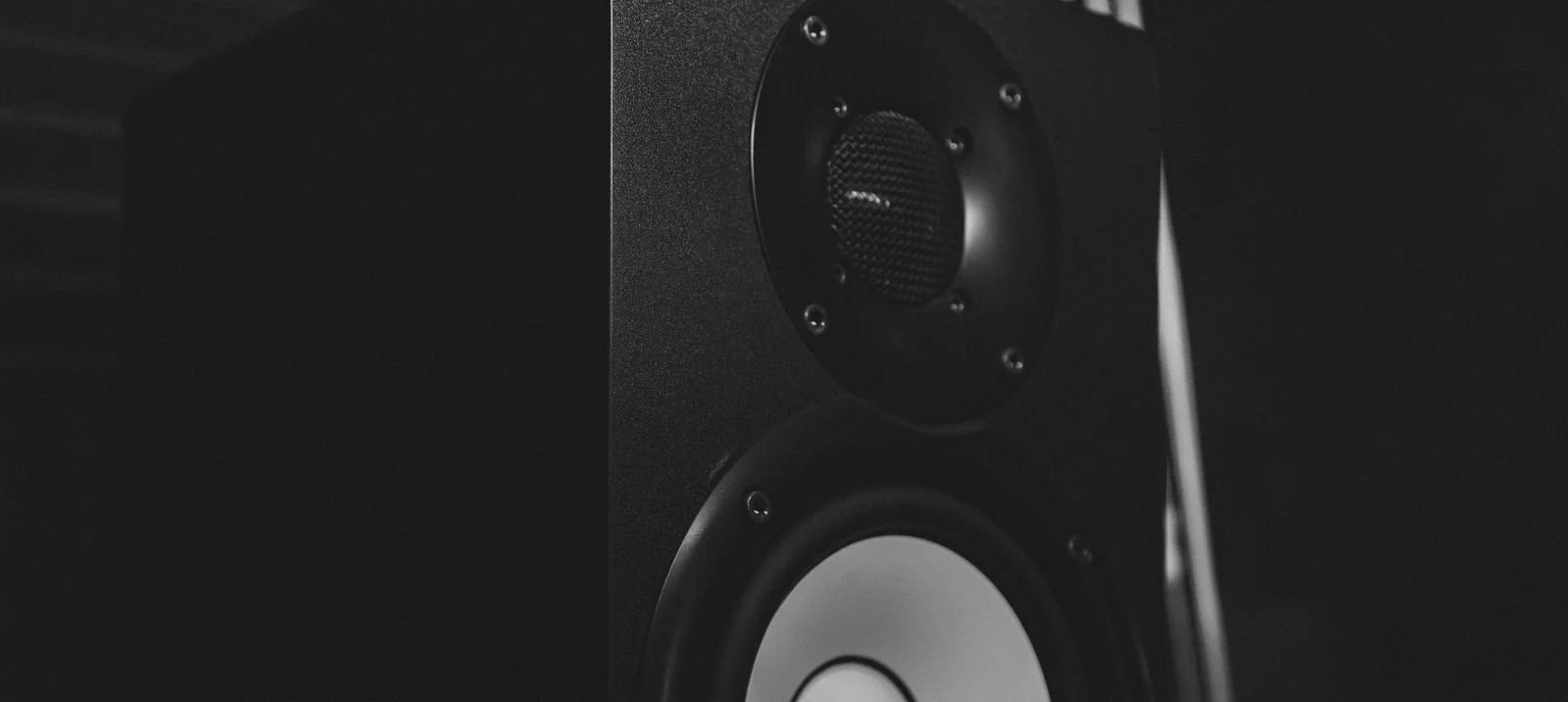 A studio monitor on its stand in the control room.